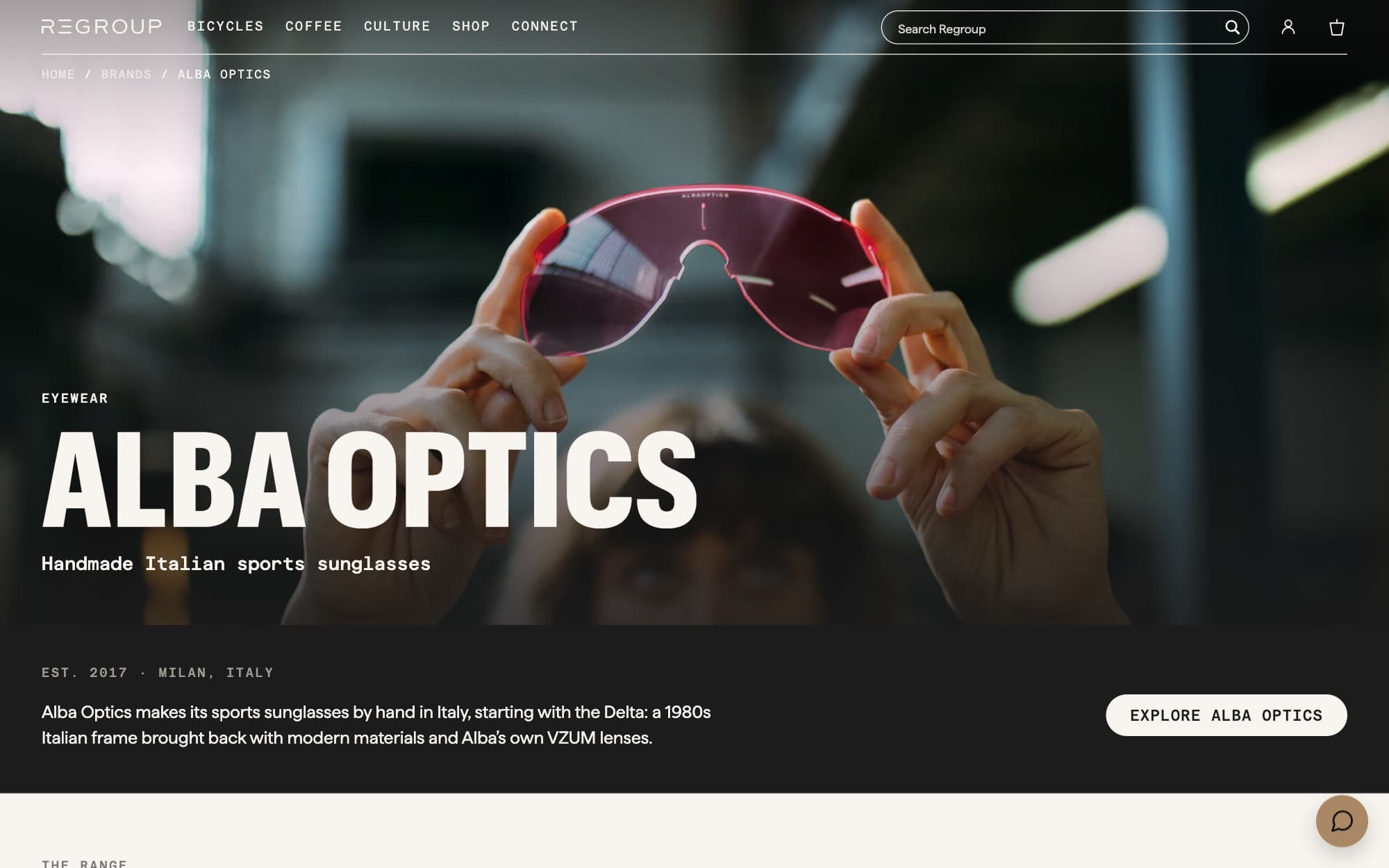 The Alba Optics brand page, with a photograph of a hand holding up a pair of pink-lensed sunglasses